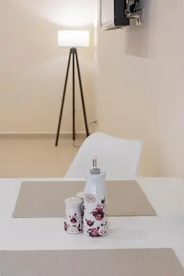 a vase and two cups sitting on a table at Kynos Athens Studio in Athens