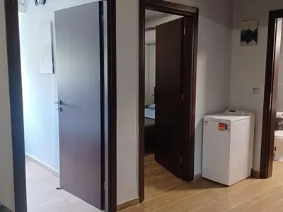 an open door to a room with a refrigerator at Family station in Athens