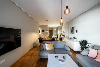 a living room with a couch and a table at Stylish 2BR with Balcony, Northern Suburbs in Athens