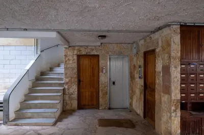 an empty hallway with stairs in an old building at Stylish 2BR with Balcony, Northern Suburbs in Athens