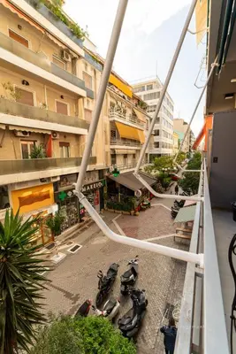 a group of motorcycles parked on a city street at Duplex in Piraeus' Best Street 2Bath w-FreeParking in Piraeus