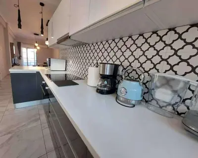 a kitchen with a counter with a coffee maker on it at An's Luxury comfort home in Athens