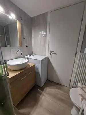 a bathroom with a sink and a toilet at An's Luxury comfort home in Athens