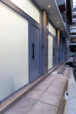 a row of doors on a building at Studio Noir in Athens