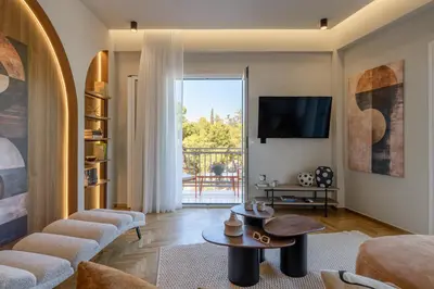 a living room with a couch and a table at Thissio Acropolis Retreat in Athens