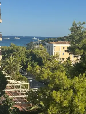 a view of a street with trees and the ocean at Athens Riviera Suite in Athens