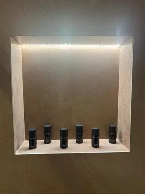 a row of black knobs on a shelf at Escape Suites - Sea View in Porto Rafti