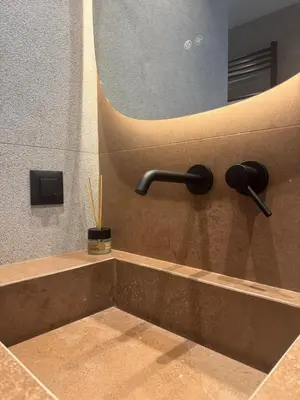 a sink in a bathroom with a mirror at Escape Suites - Sea View in Porto Rafti