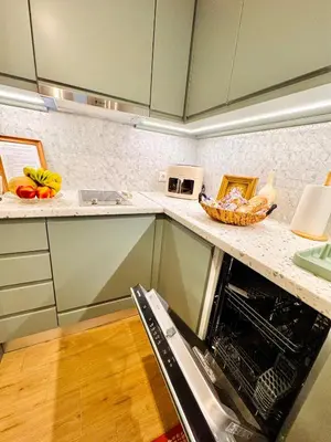 a kitchen with a dishwasher and a counter top at 70's Vintage Hideaway Appartment in Athens