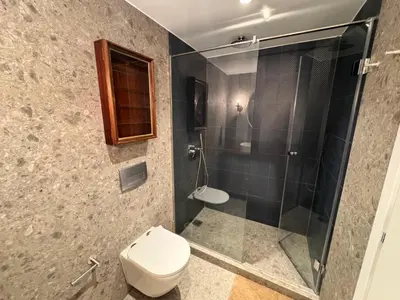 a bathroom with a toilet and a shower at 70's Vintage Hideaway Appartment in Athens