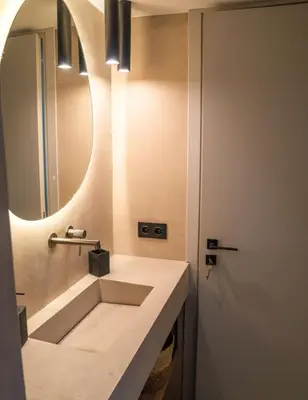 a bathroom with a sink and a mirror at Philosykos Suite in Athens