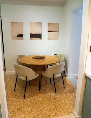 a dining room with a wooden table and chairs at Philosykos Suite in Athens