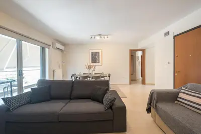 a living room with a couch and a table at Cozy 2 bedroom flat near Gazi in Athens