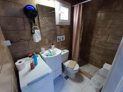 a small bathroom with a toilet and a sink at Kresorts 13 in Athens