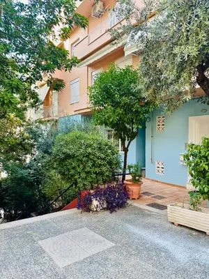 a building with trees and flowers in front of it at Sem Athens House -entire 70m2 house- in Athens