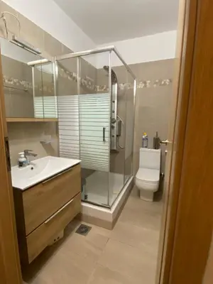 a bathroom with a shower and a sink and a toilet at EUPHORIA Pool Villa in Porto Rafti