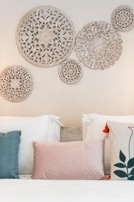 a room with pillows and plates on the wall at 2BR Beatiful Apt In Thissio Near Agora & Acropolis in Athens