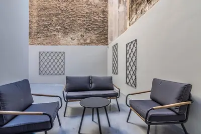 a waiting room with two chairs and a table at Luxurius Studio Near Plaka & Acropolis 1 in Athens