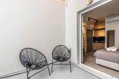 two chairs sitting in a room with a mirror at Luxurius Studio Near Plaka & Acropolis 2 in Athens