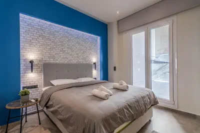 a bedroom with a large bed with towels on it at Luxurius Studio Near Plaka & Acropolis 2 in Athens
