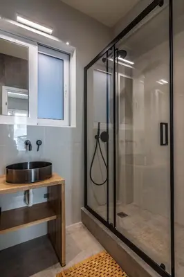 a bathroom with a glass shower and a sink at Luxurius Studio Near Plaka & Acropolis 2 in Athens