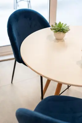 a white table with a blue chair and a plant on it at Luxurius Studio Near Plaka & Acropolis 3 in Athens