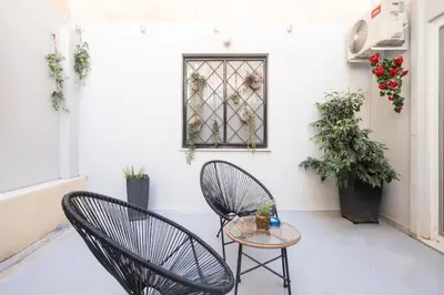 a patio with two chairs and a table at Luxurius Studio Near Plaka & Acropolis 3 in Athens