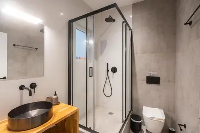 a bathroom with a sink and a shower at Luxurius Studio Near Plaka & Acropolis 3 in Athens