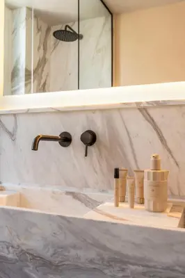 a bathroom counter with a sink and a mirror at Acropolis 1910s Neoclassical Gem Marble Bathrooms in Athens