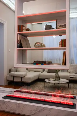 a living room with a couch and a table at Acropolis 1910s Neoclassical Gem Marble Bathrooms in Athens