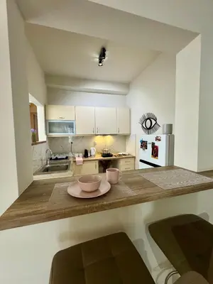 a kitchen with a table with two bowls on it at Athens Nest in Athens