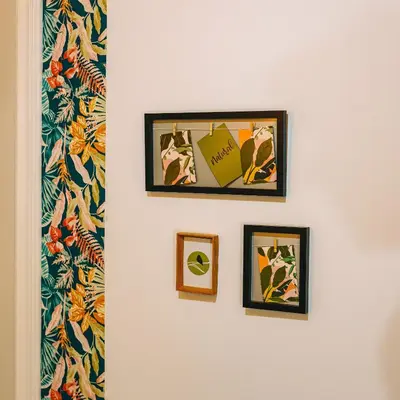 a hallway with three framed pictures on a wall at Rebel's Rest - 4BR Apartment in Athens