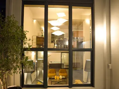 a room with windows with yellow chairs in it at Ma Maison No9 Downtown Villa,Jacuzzi,5bdrs,Parking in Athens