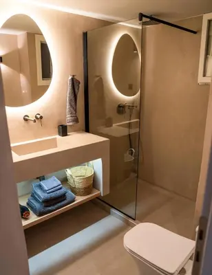 a bathroom with a shower and a sink and a toilet at The halcyon house in Athens