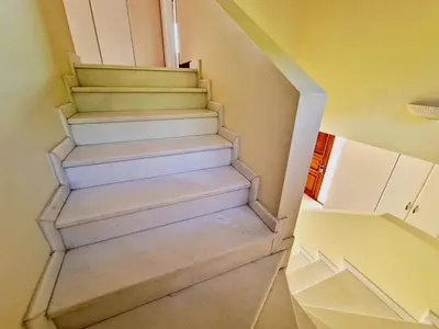 a stairway in a room with a stair case at Ethea in Anavissos