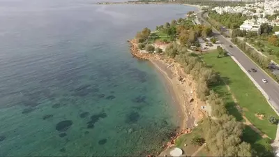 an aerial view of a beach and the ocean at Voula Private Pool, Beach, Home cinema Apartment in Athens