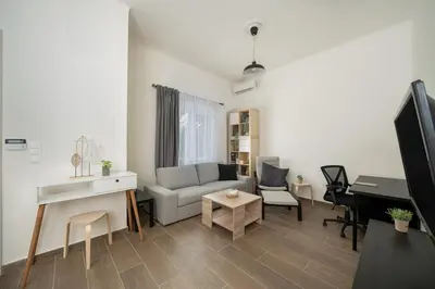 a living room with a couch and a piano at Santa Marina - Comfortable & Cozy House in Egaleo-Athens in Athens