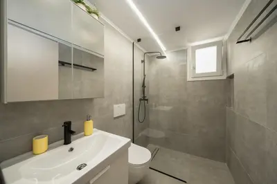 a bathroom with a sink and a toilet and a shower at Santa Marina - Comfortable & Cozy House in Egaleo-Athens in Athens