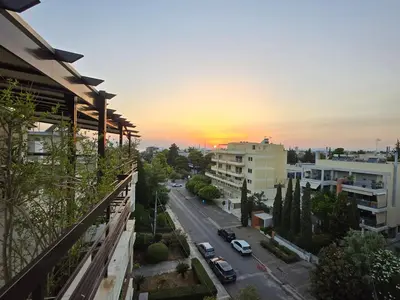 a view of a city street at sunset at The-terrace-of-glyfada in Athens