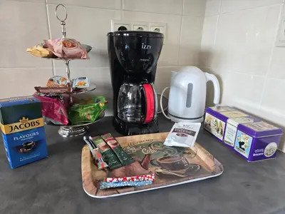 a counter top with a coffee maker and a blender at The-terrace-of-glyfada in Athens