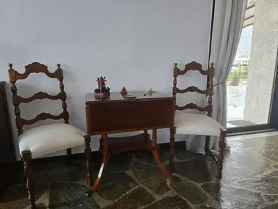 a table and two chairs next to a window at The-terrace-of-glyfada in Athens