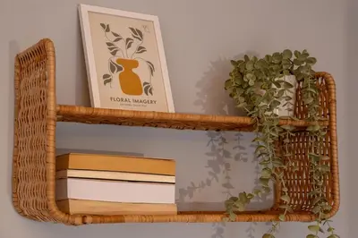 a wooden shelf with books and a picture and a plant at Joo Nest - Your home near Piraeus Port in Piraeus