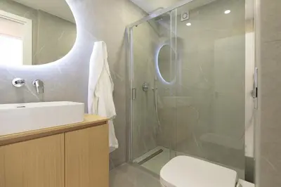a bathroom with a shower and a toilet and a sink at Athenean Private Pool Heaven in Athens