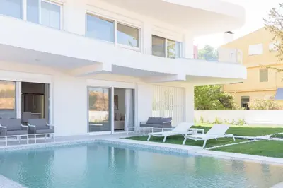a house with a swimming pool in front of it at Athenean Private Pool Heaven in Athens