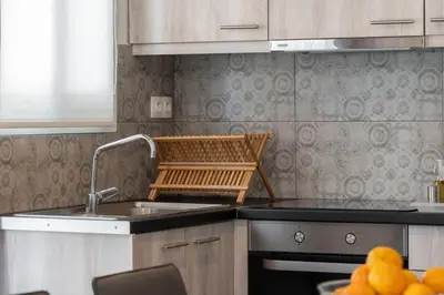 a kitchen with a sink and a stove at Aera Nest - 2BR, Alimos in Athens
