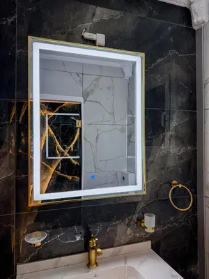 a bathroom with a large mirror over a sink at Aphrodite Apartment in Athens
