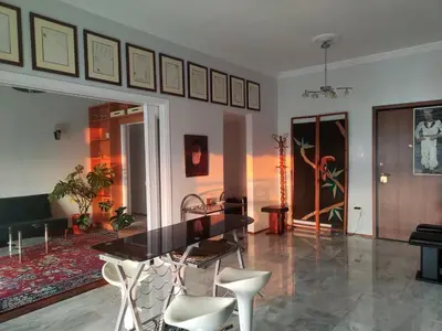 a dining room with a black table and chairs at Mediterranean Penthouse in the center of Athens in Athens