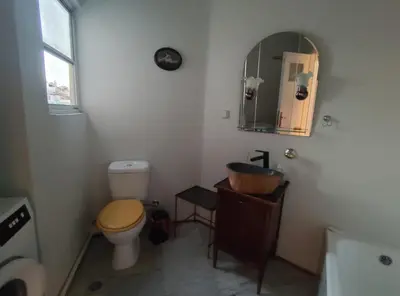 a bathroom with a toilet and a sink and a mirror at Mediterranean Penthouse in the center of Athens in Athens