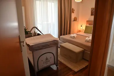 a small room with a bed and a room with a bed sqor at Athénée Retreat in Athens