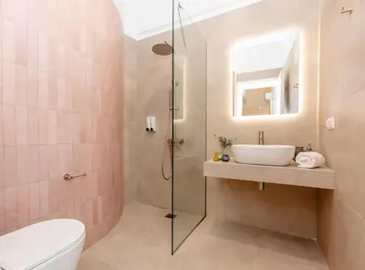 a bathroom with a shower and a sink and a toilet at Livinn Acropolis View in Athens